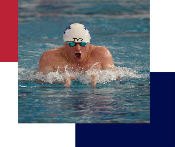 Swimmer performing breaststroke with white cap